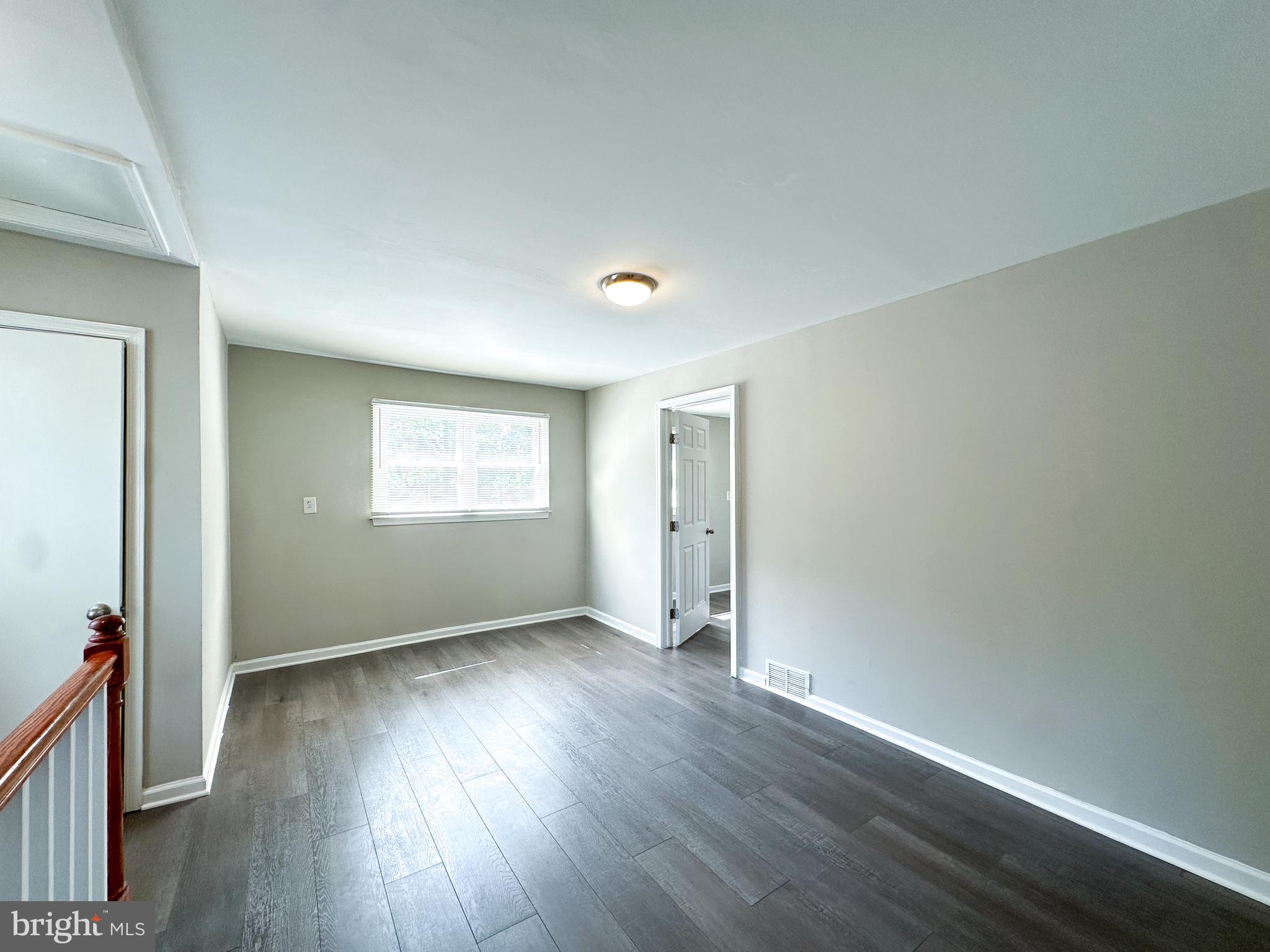 2191 Dunks Ferry Road Bensalem, PA 19020 - Photo 23 of 33 an empty room with wooden floor and windows