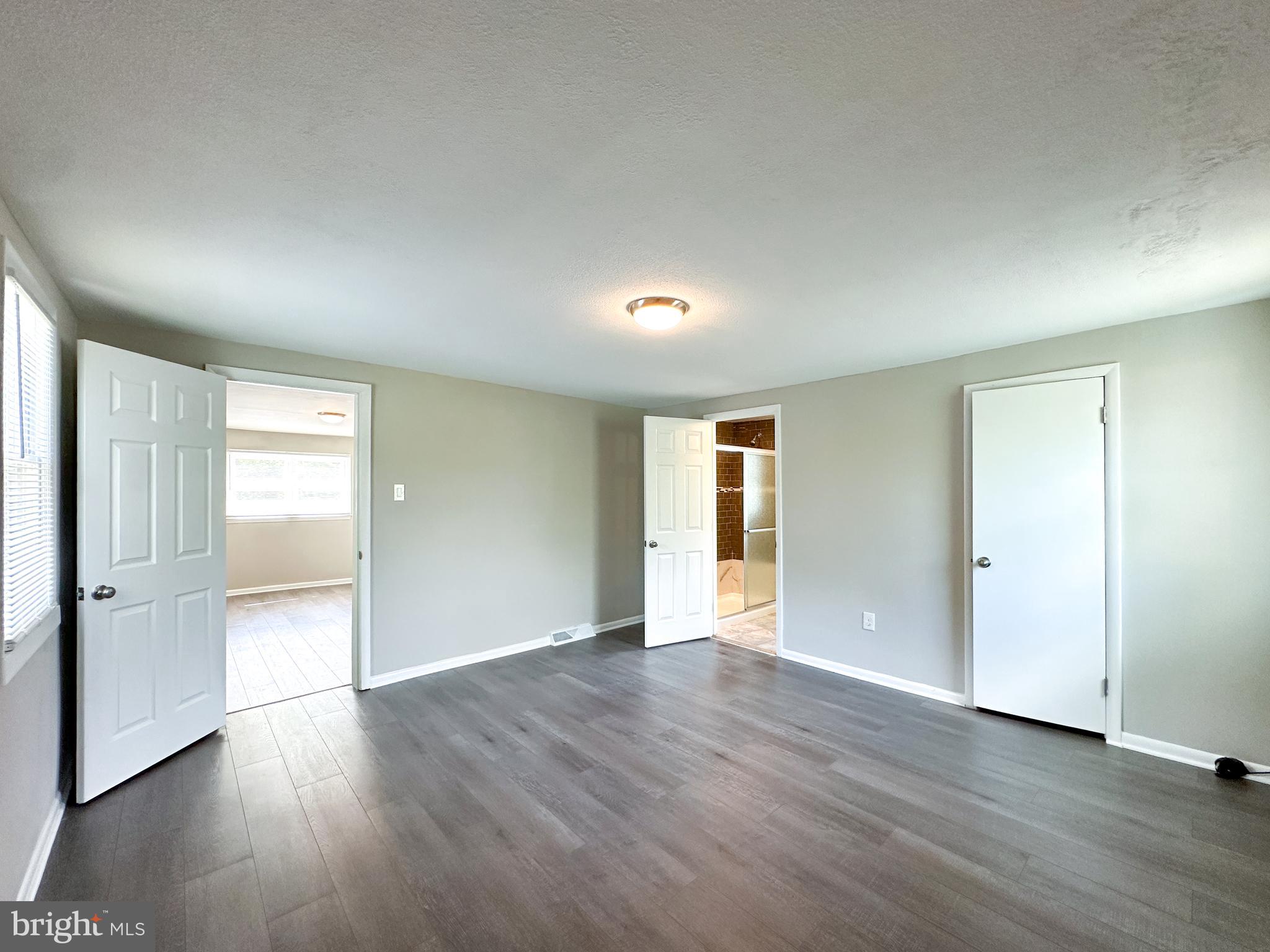 2191 Dunks Ferry Road Bensalem, PA 19020 - Photo 27 of 33 an empty room with wooden floor and windows