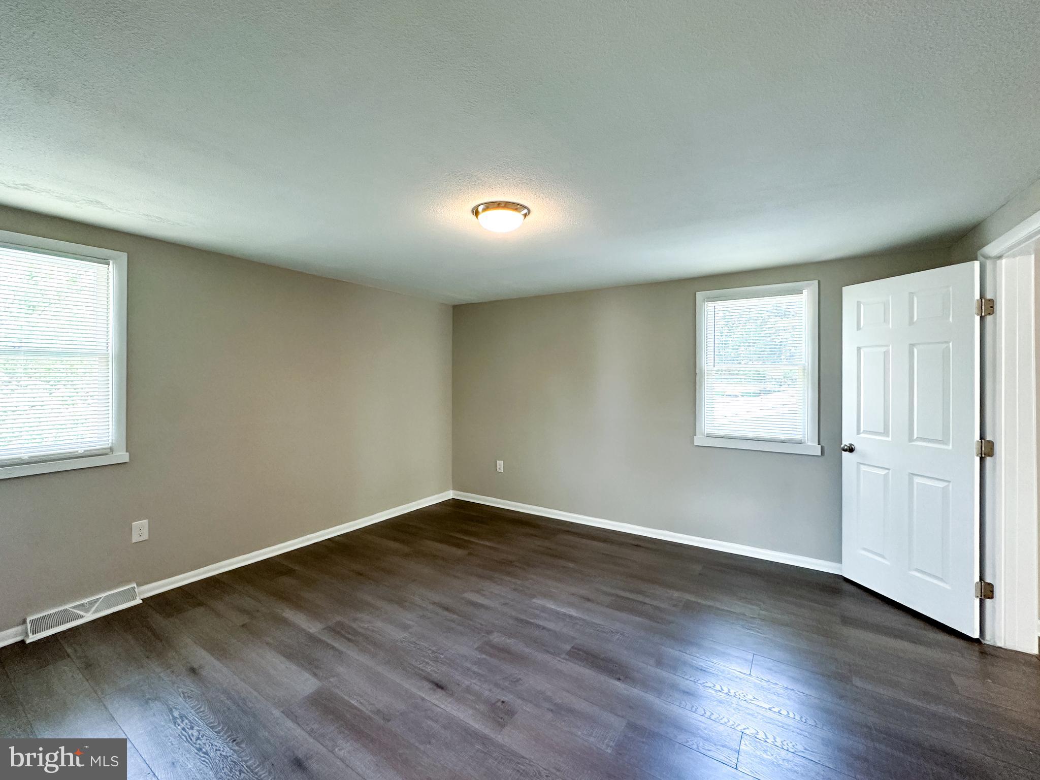 2191 Dunks Ferry Road Bensalem, PA 19020 - Photo 29 of 33 an empty room with wooden floor and windows