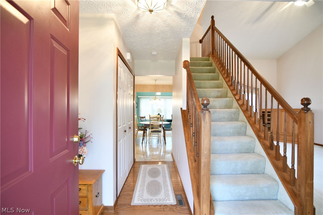 2703 Canton Road Uniontown, OH 44685 - Photo 6 of 34 Foyer entry features hardwood flooring and coat closet!