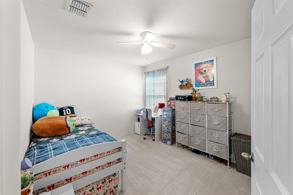 9000 Quarry Ridge Trail Fort Worth, TX 76244 - Photo 14 of 32 a bedroom with furniture and a baby crib