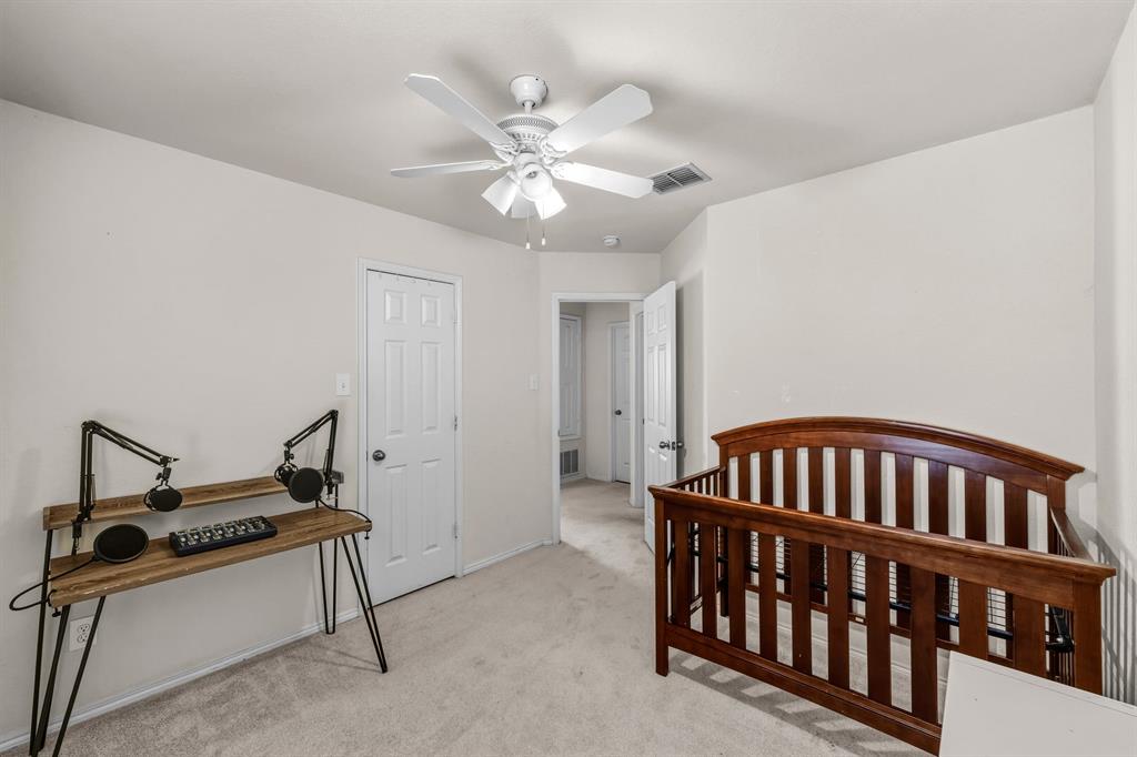 9000 Quarry Ridge Trail Fort Worth, TX 76244 - Photo 17 of 32 a bedroom with furniture and a chandelier fan