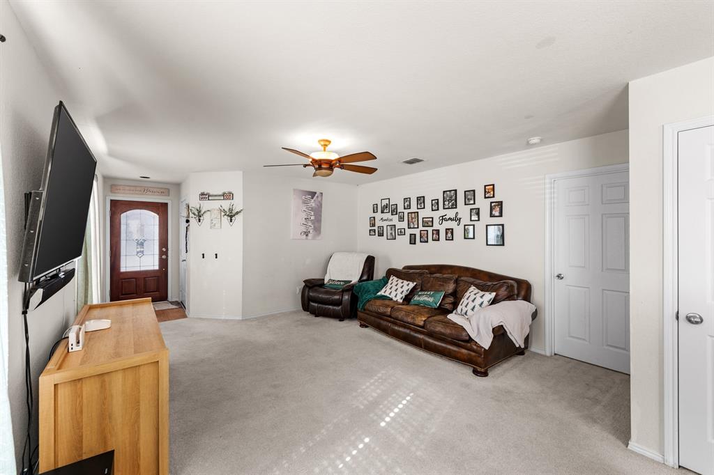 9000 Quarry Ridge Trail Fort Worth, TX 76244 - Photo 21 of 32 a living room with furniture and a flat screen tv