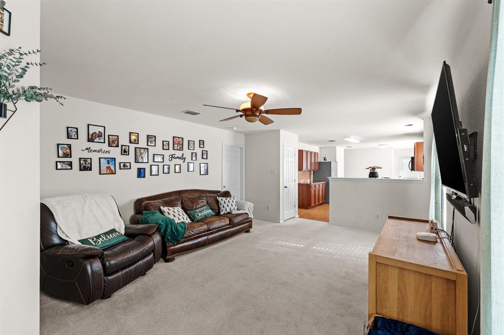 9000 Quarry Ridge Trail Fort Worth, TX 76244 - Photo 22 of 32 a living room with furniture and a flat screen tv