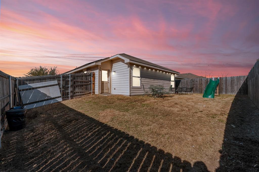 9000 Quarry Ridge Trail Fort Worth, TX 76244 - Photo 24 of 32 a front view of a house with a yard