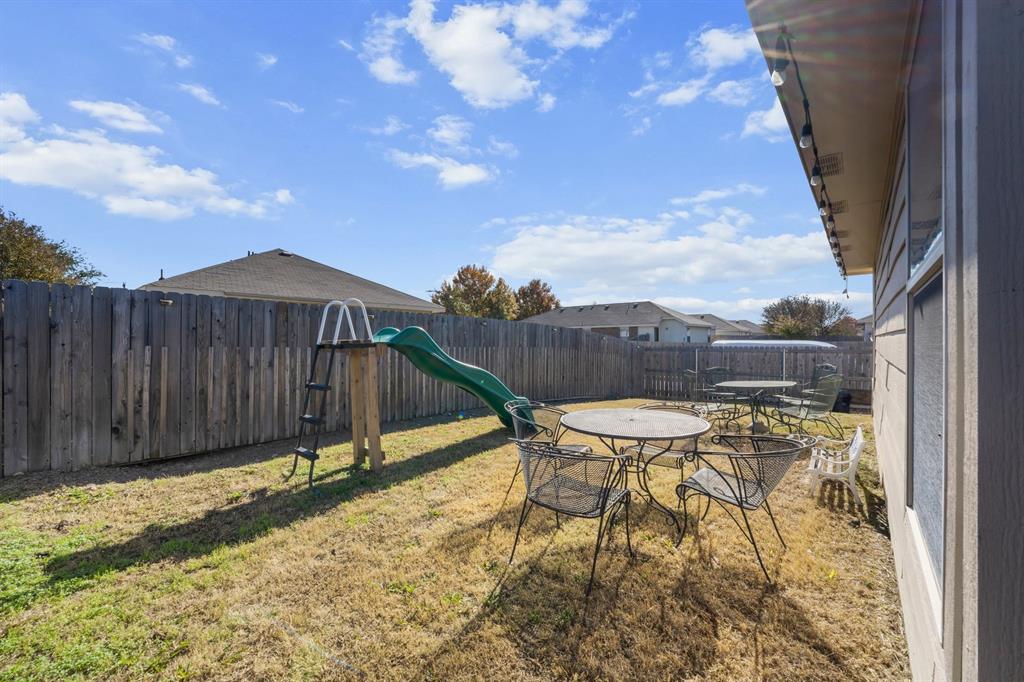 9000 Quarry Ridge Trail Fort Worth, TX 76244 - Photo 27 of 32 a view of a chairs and table in the backyard