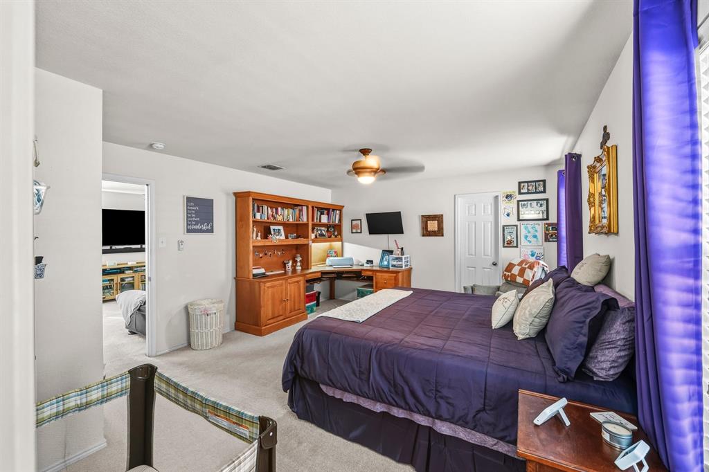 9000 Quarry Ridge Trail Fort Worth, TX 76244 - Photo 4 of 32 a bedroom with a bed and flat screen tv