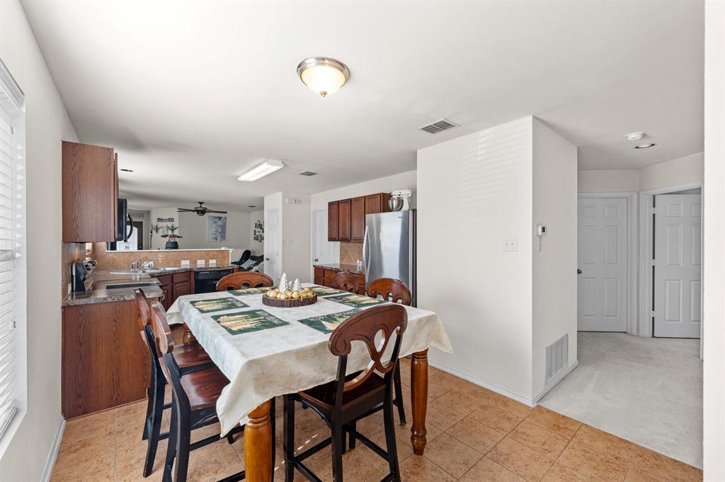 9000 Quarry Ridge Trail Fort Worth, TX 76244 - Photo 8 of 32 a view of a dining room with furniture
