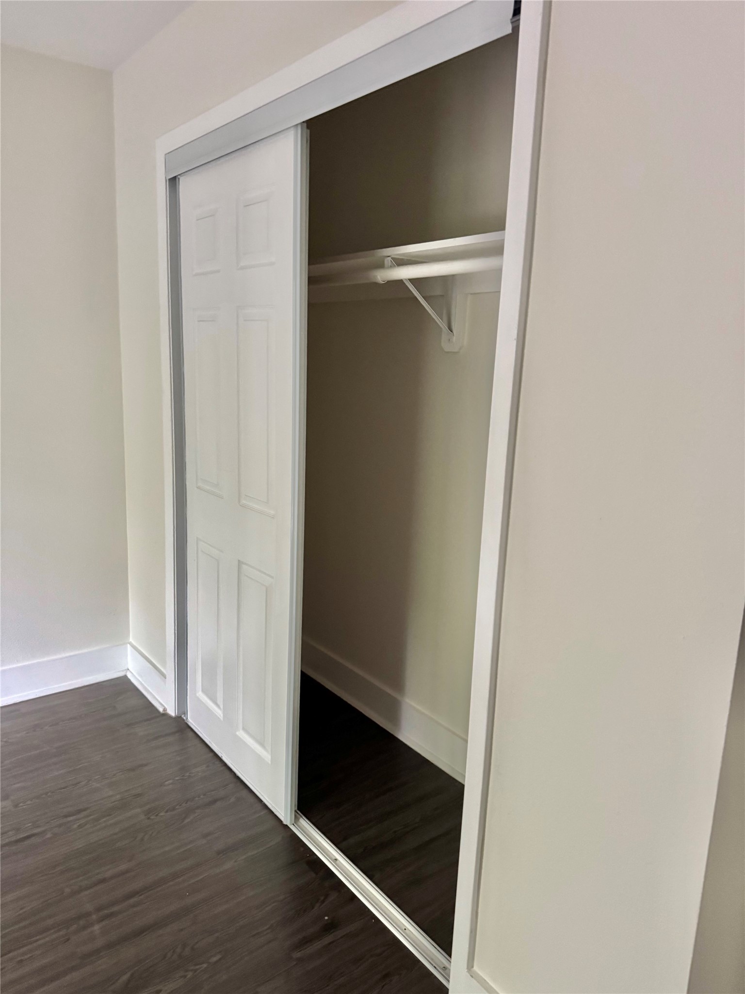 935 La Posada Drive, Unit 252 Austin, TX 78752 - Photo 11 of 20 a view of walk in closet with wooden floor