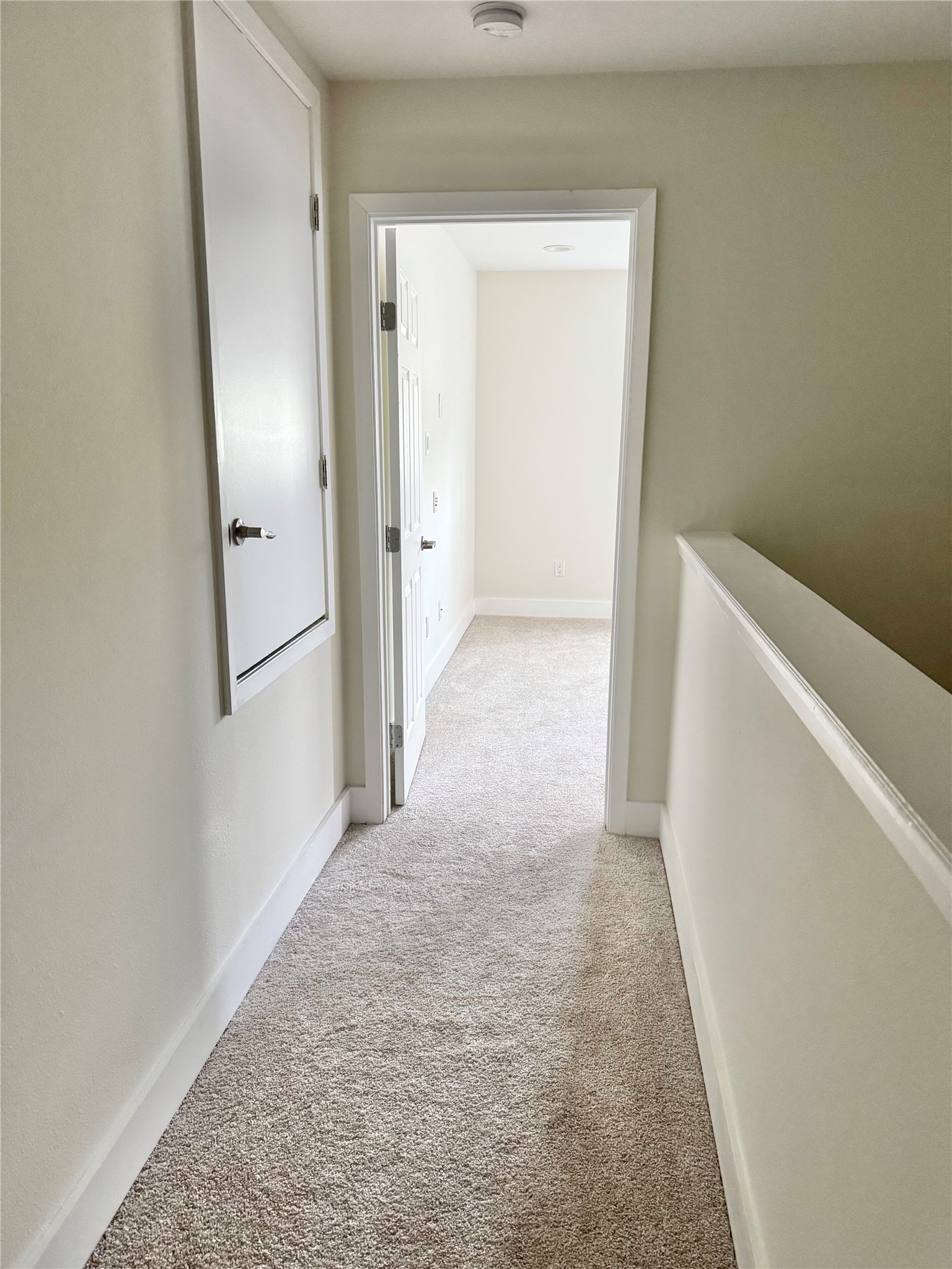 935 La Posada Drive, Unit 252 Austin, TX 78752 - Photo 13 of 20 a view of a hallway with wooden floor
