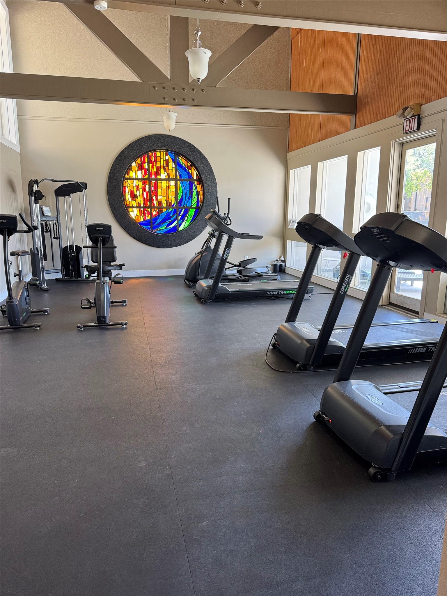 935 La Posada Drive, Unit 252 Austin, TX 78752 - Photo 19 of 20 an empty room with windows and air hockey table