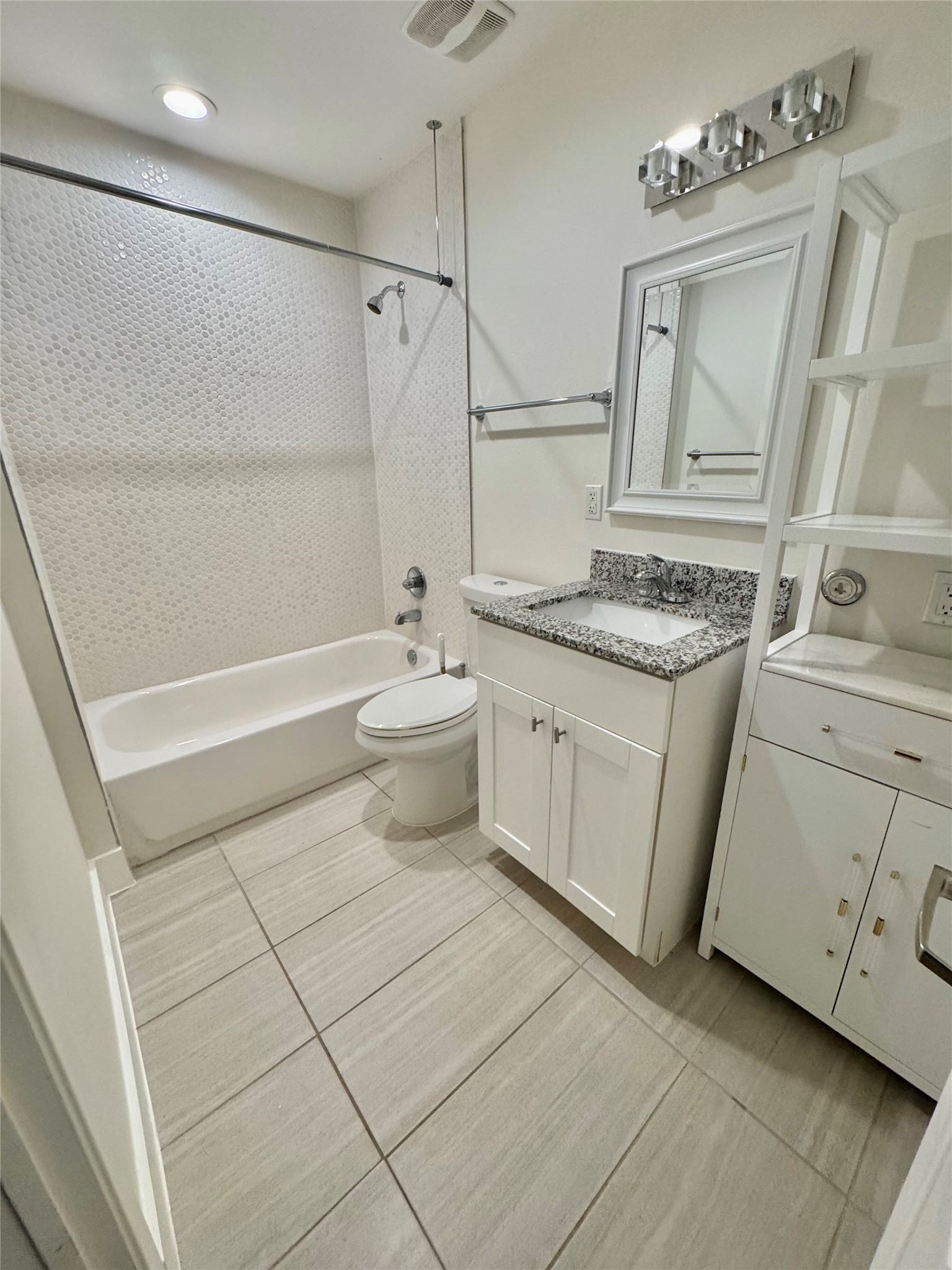 935 La Posada Drive, Unit 252 Austin, TX 78752 - Photo 10 of 20 a bathroom with a sink a toilet and shower