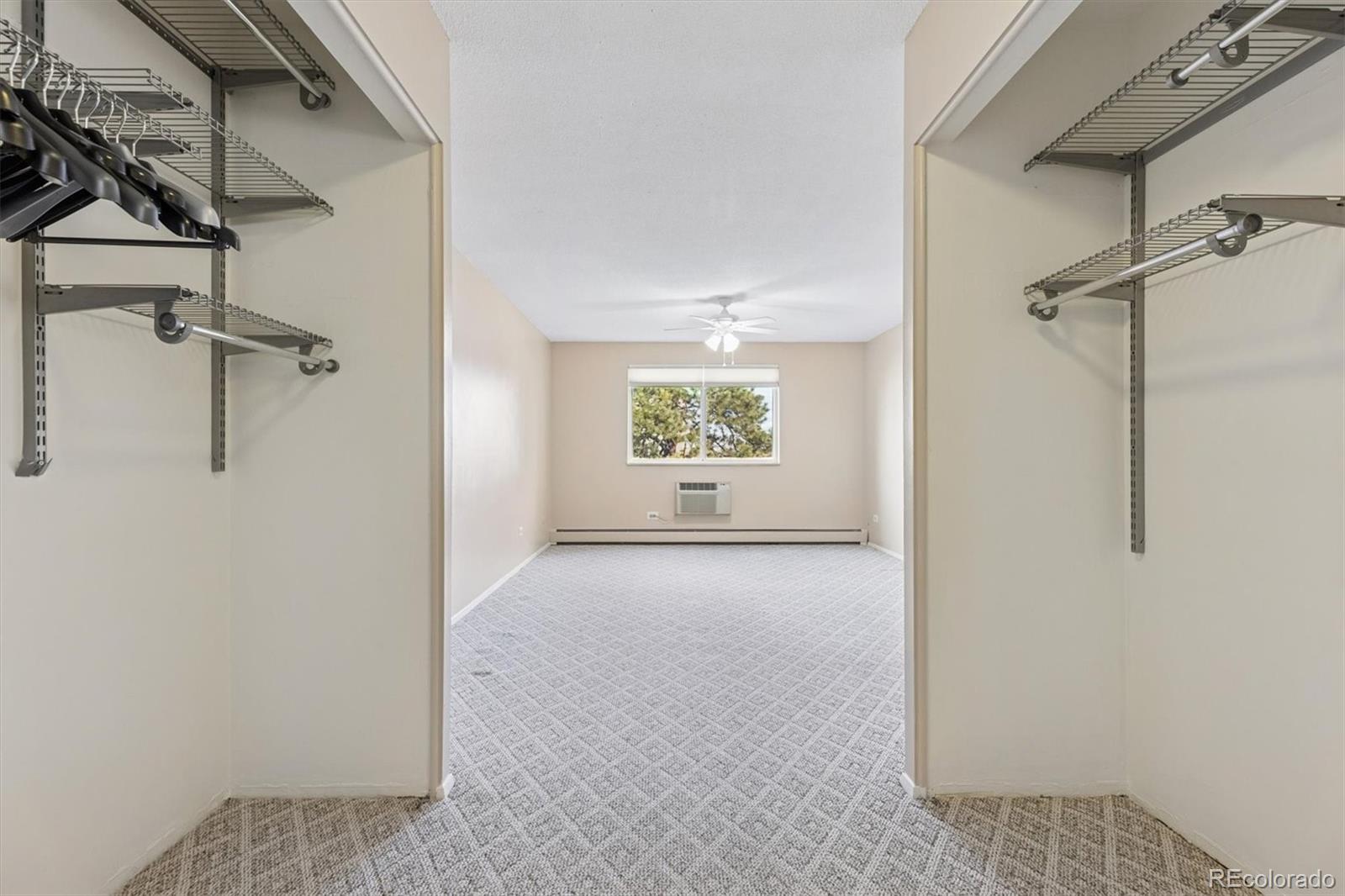 350 South Clinton Street, Unit 8B Denver, CO 80247 - Photo 12 of 50 a view of a hallway with a window