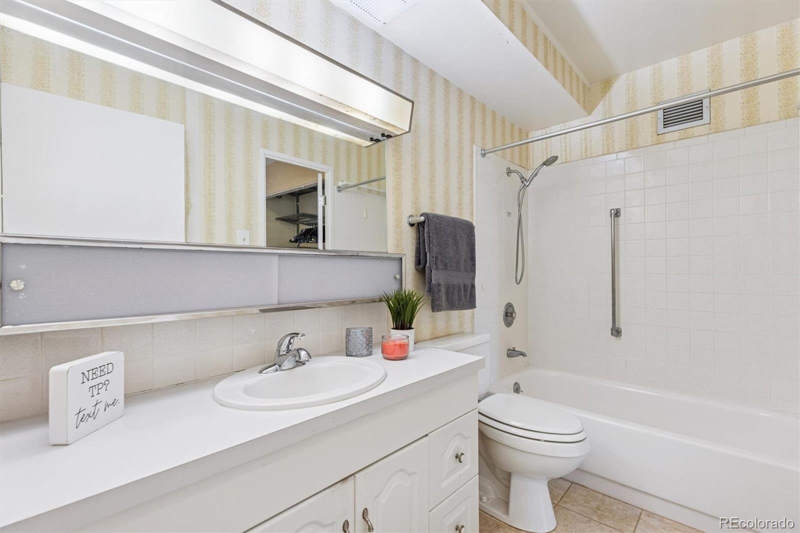 350 South Clinton Street, Unit 8B Denver, CO 80247 - Photo 13 of 50 a bathroom with a sink a toilet and shower