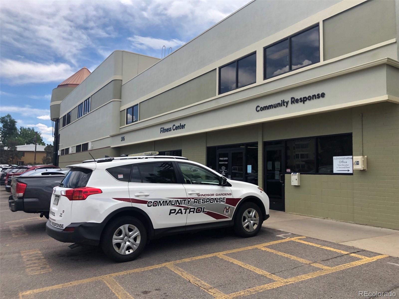 350 South Clinton Street, Unit 8B Denver, CO 80247 - Photo 25 of 50 a view of a car parked in front of a building