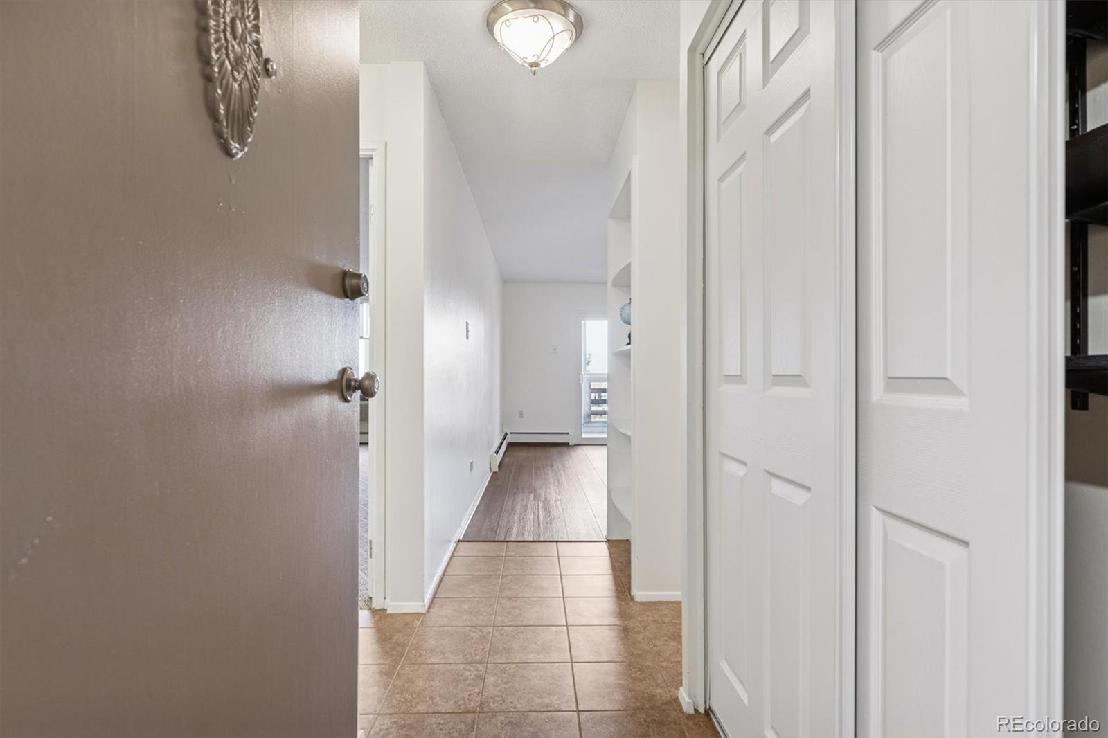 350 South Clinton Street, Unit 8B Denver, CO 80247 - Photo 3 of 50 a view of a hallway