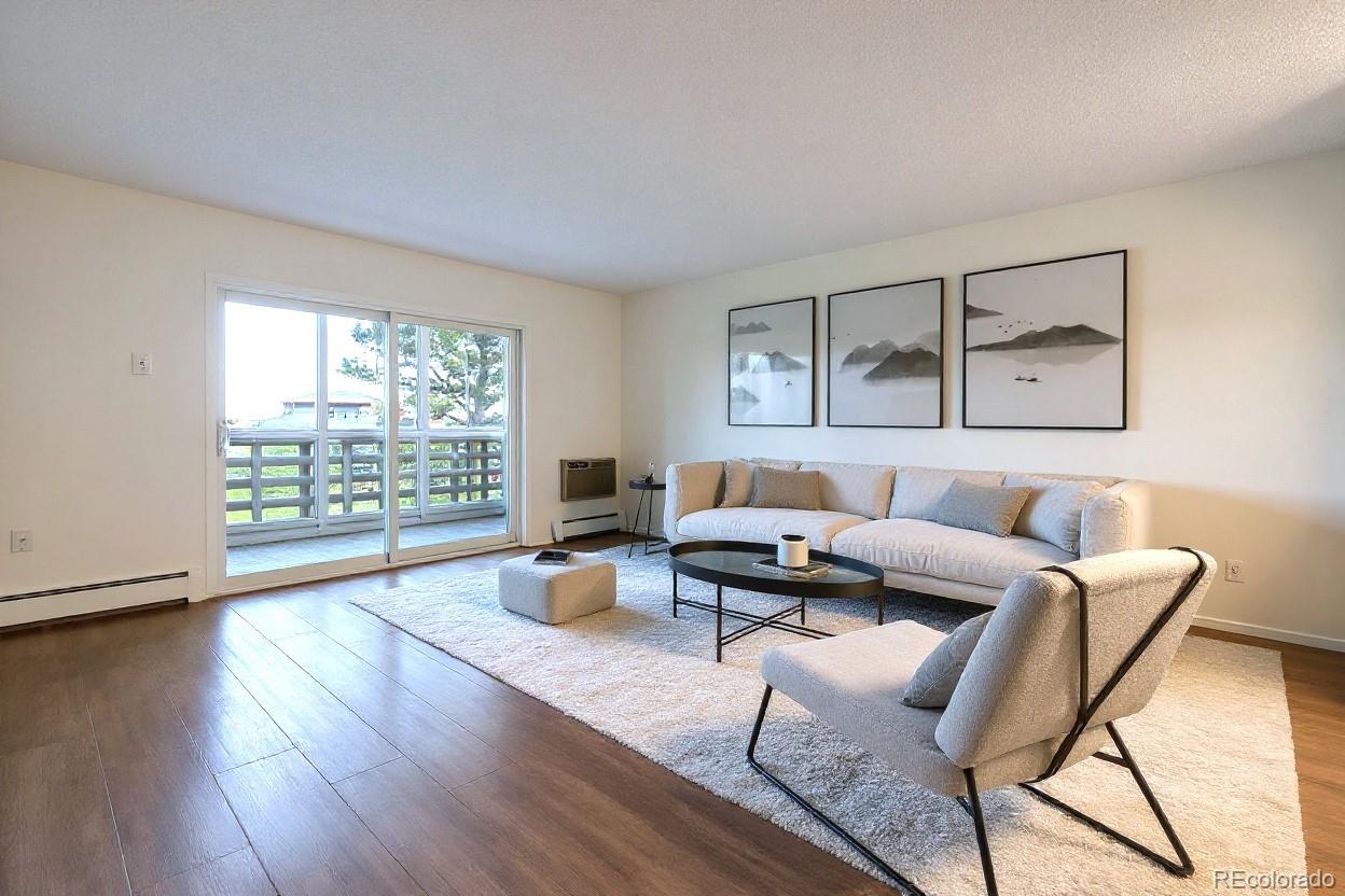 350 South Clinton Street, Unit 8B Denver, CO 80247 - Photo 5 of 50 a living room with furniture and a wooden floor