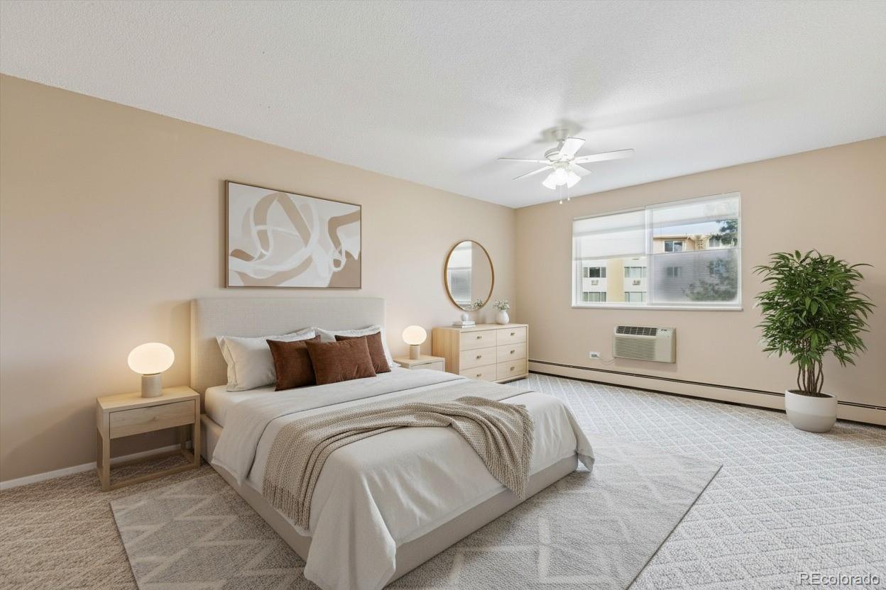 350 South Clinton Street, Unit 8B Denver, CO 80247 - Photo 10 of 50 a bedroom with a bed and a chandelier