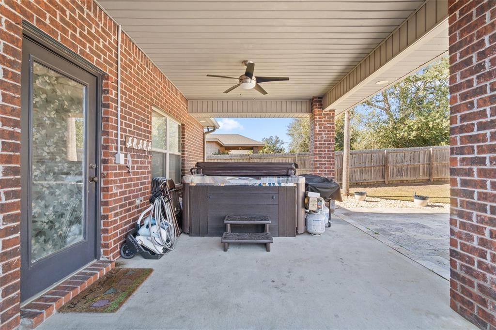 5973 Rustic Ridge Circle Milton, FL 32570 - Photo 11 of 44 a view of a livingroom with a fireplace and a chandelier