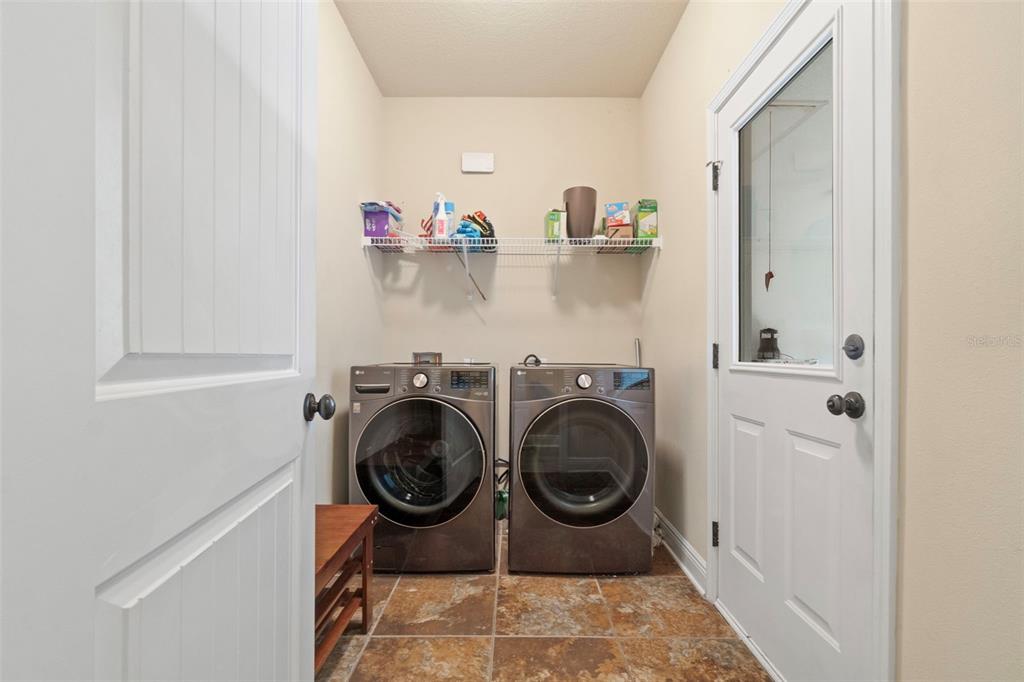 5973 Rustic Ridge Circle Milton, FL 32570 - Photo 13 of 44 a utility room with sink dryer and washer