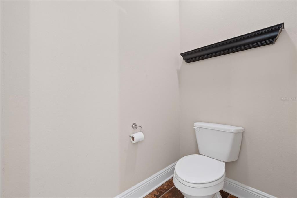 5973 Rustic Ridge Circle Milton, FL 32570 - Photo 20 of 44 a white toilet sitting next to a white wall