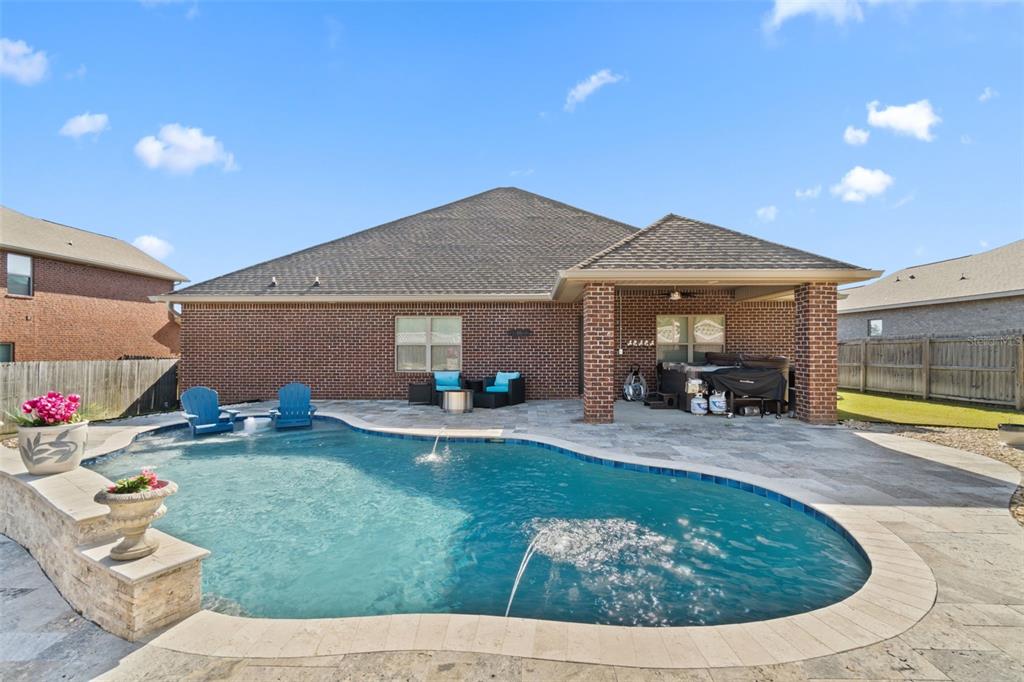 5973 Rustic Ridge Circle Milton, FL 32570 - Photo 2 of 44 a view of a house with backyard porch and sitting area