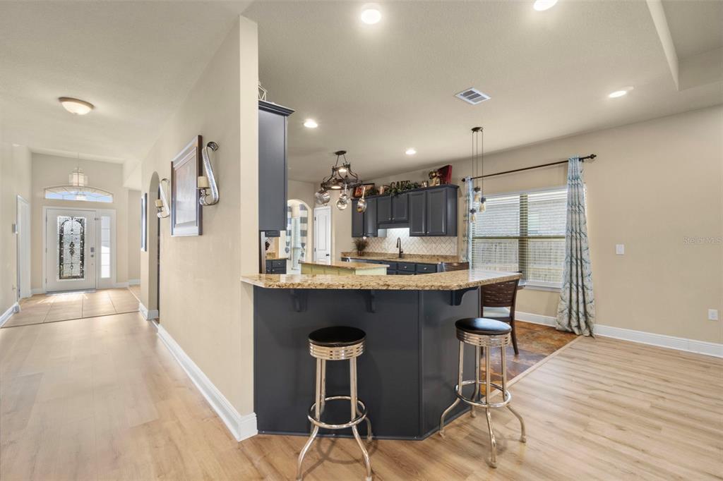5973 Rustic Ridge Circle Milton, FL 32570 - Photo 22 of 44 a kitchen with a table and chairs in it