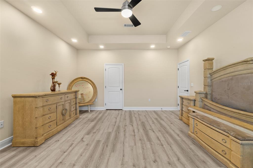 5973 Rustic Ridge Circle Milton, FL 32570 - Photo 25 of 44 wooden floor in an empty room with a window