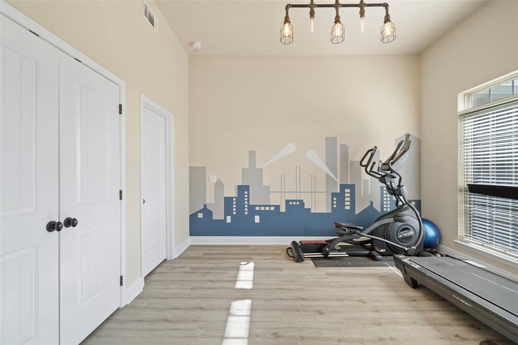 5973 Rustic Ridge Circle Milton, FL 32570 - Photo 30 of 44 a view of a room with gym equipment