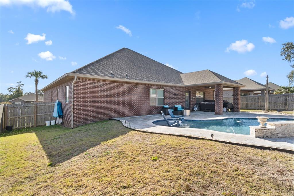 5973 Rustic Ridge Circle Milton, FL 32570 - Photo 3 of 44 a view of a house with swimming pool and sitting area
