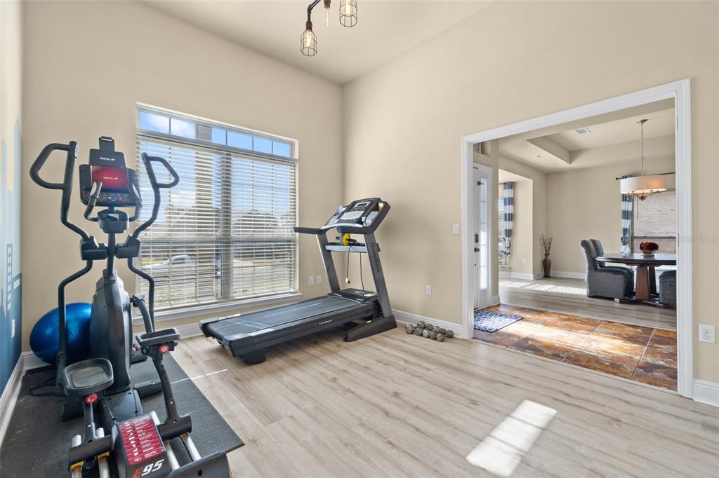 5973 Rustic Ridge Circle Milton, FL 32570 - Photo 31 of 44 a view of a room with gym equipment