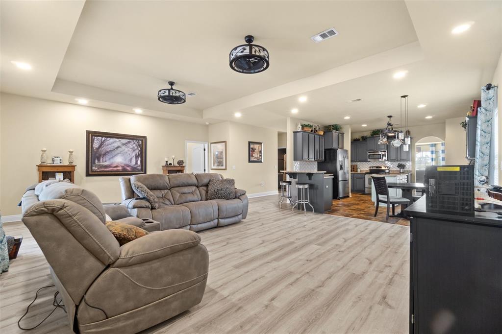 5973 Rustic Ridge Circle Milton, FL 32570 - Photo 34 of 44 a living room with furniture and a flat screen tv