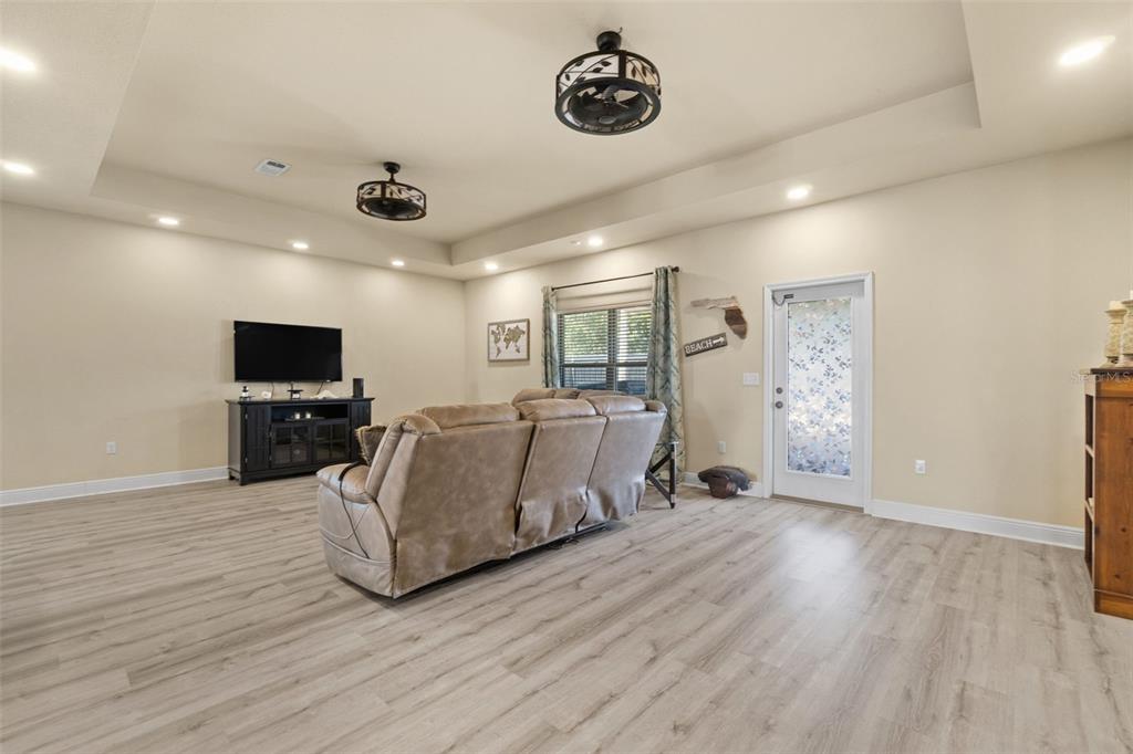 5973 Rustic Ridge Circle Milton, FL 32570 - Photo 36 of 44 a living room with furniture and a flat screen tv