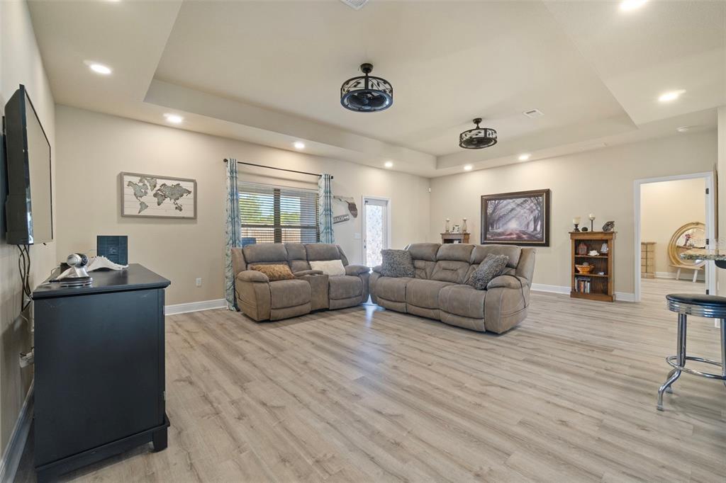 5973 Rustic Ridge Circle Milton, FL 32570 - Photo 41 of 44 a living room with furniture and a flat screen tv