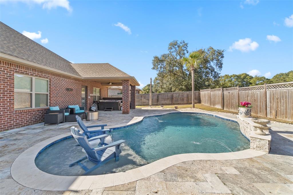 5973 Rustic Ridge Circle Milton, FL 32570 - Photo 6 of 44 a view of a house with swimming pool and a sitting area
