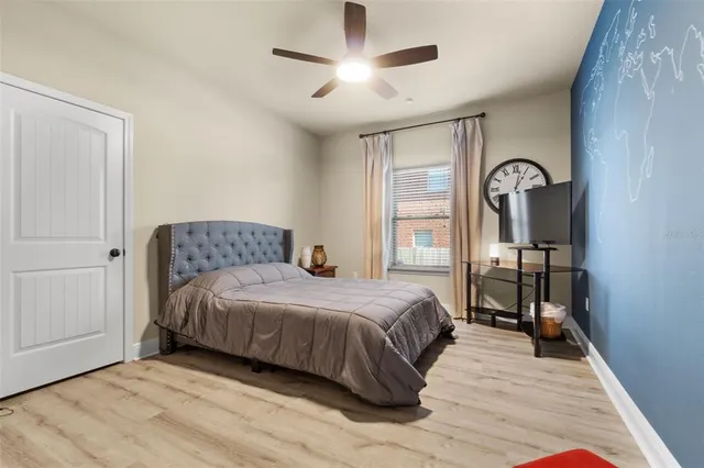 a view of a livingroom with a fireplace and a chandelier