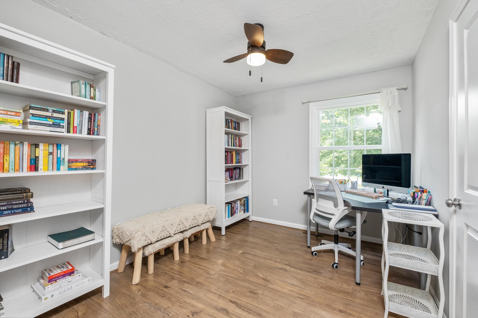 50 Valley Road Ruckersville, VA 22968 - Photo 15 of 39 a view of a workspace with furniture and a bookshelf