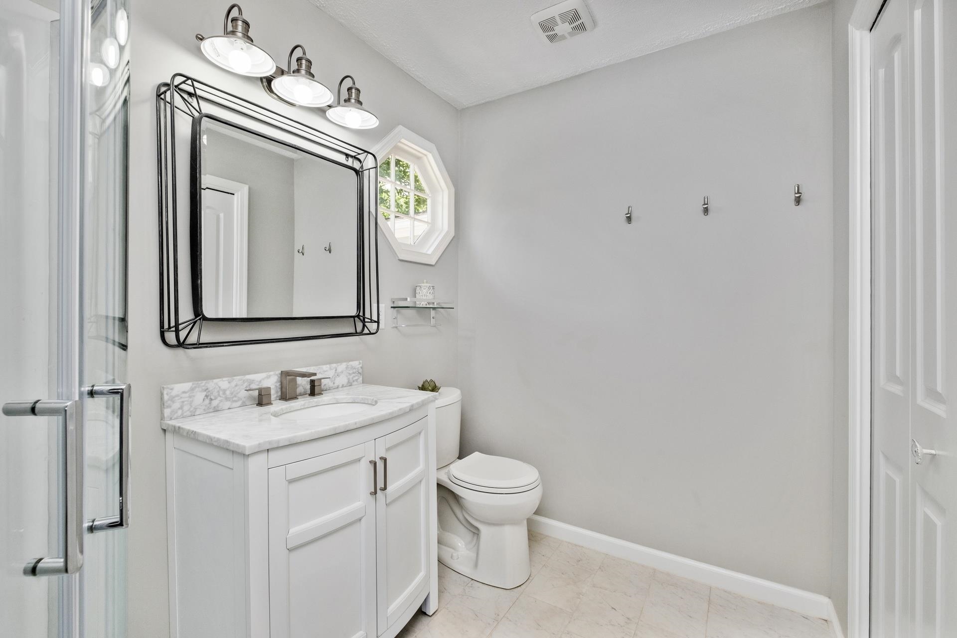 50 Valley Road Ruckersville, VA 22968 - Photo 19 of 39 a bathroom with a toilet sink and mirror