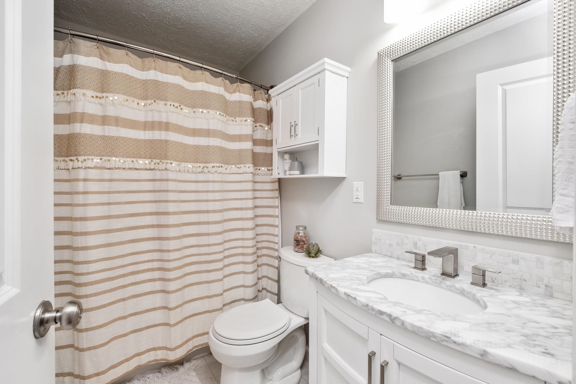 50 Valley Road Ruckersville, VA 22968 - Photo 28 of 39 a bathroom with a granite countertop sink toilet and mirror