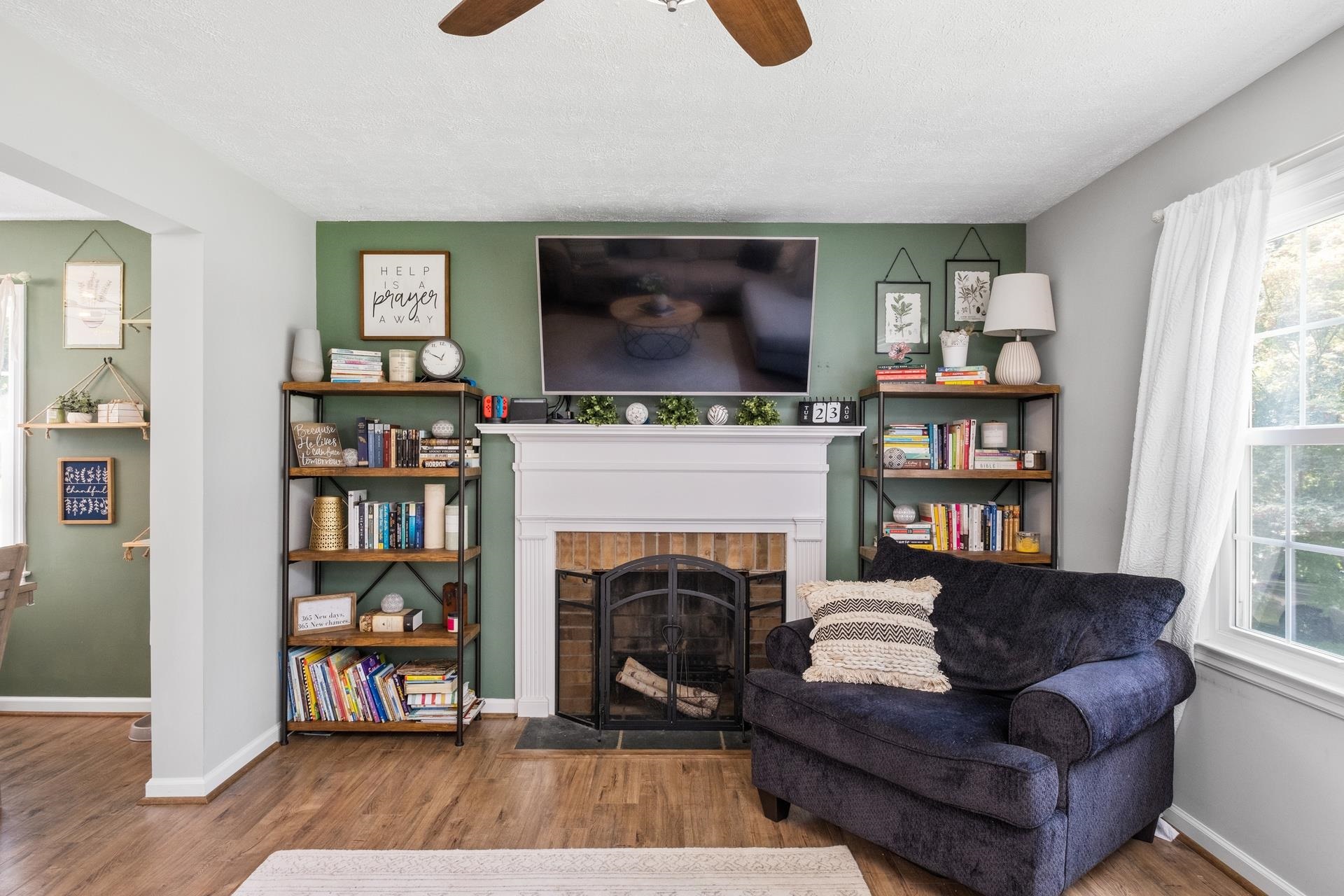 50 Valley Road Ruckersville, VA 22968 - Photo 7 of 39 a living room with furniture a bookshelf and a fireplace
