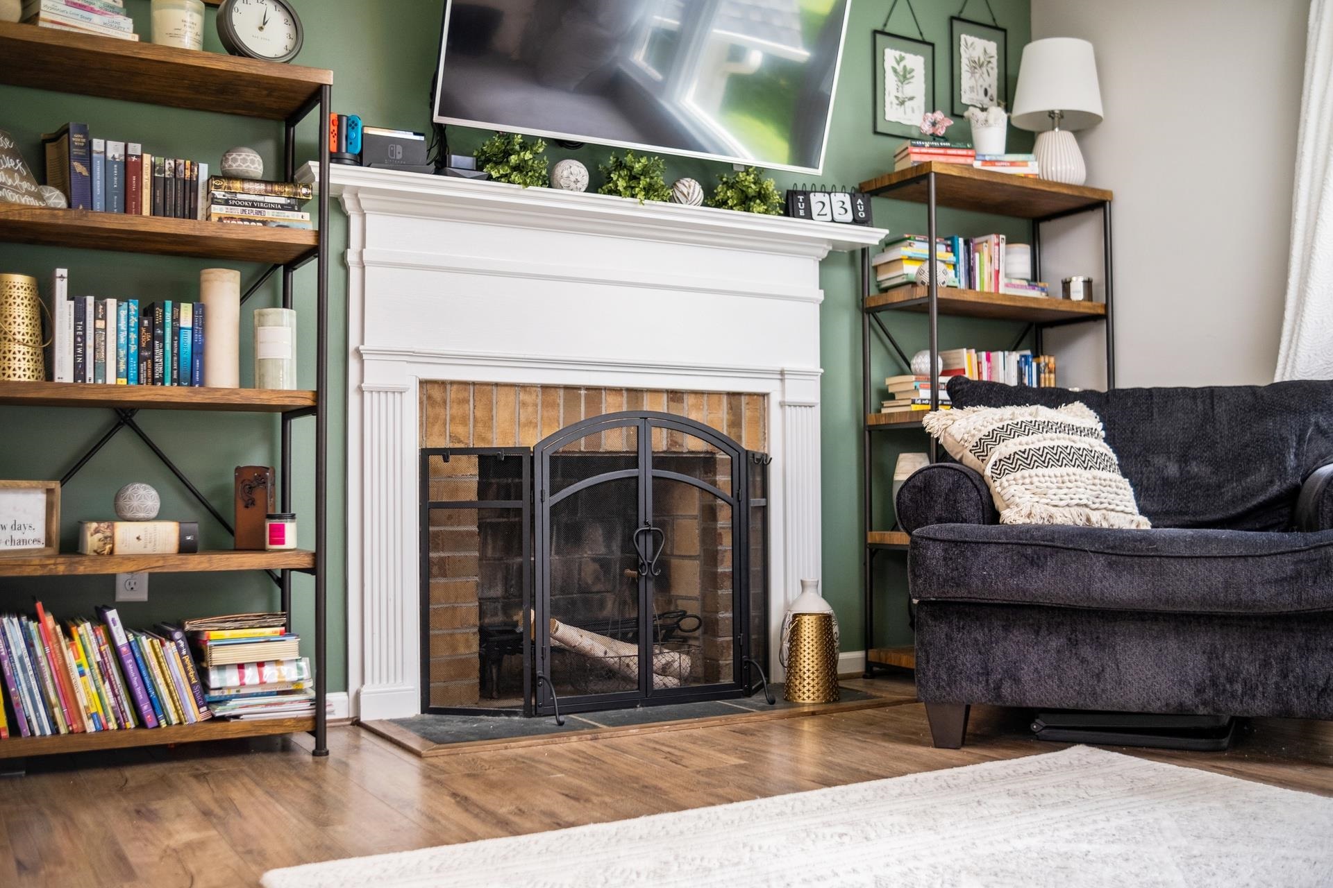 50 Valley Road Ruckersville, VA 22968 - Photo 8 of 39 a living room with fireplace furniture and a book shelf