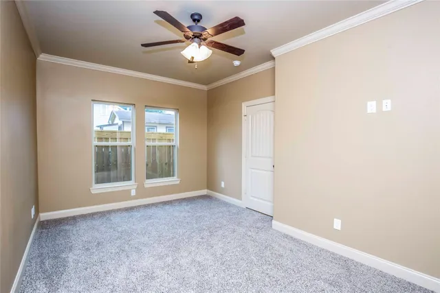 a view of a kitchen with cabinets and wooden floor