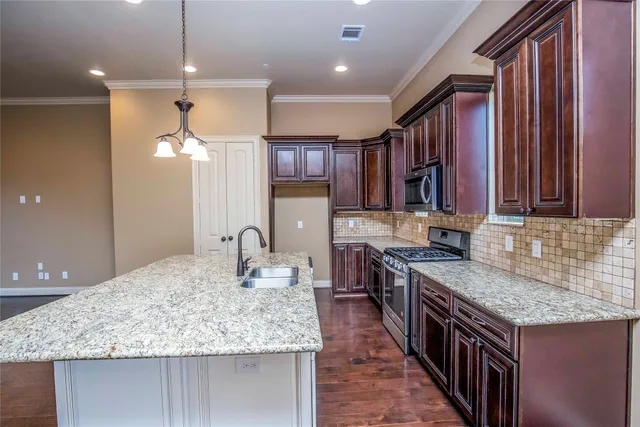 a view of staircase with railing and white walls