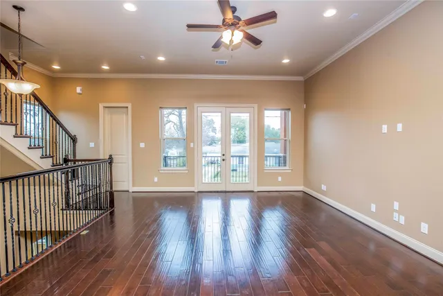 a view of an entryway with wooden floor