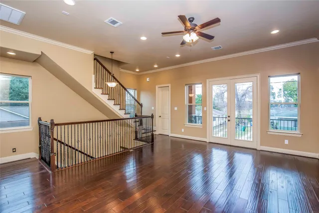a bedroom with a bed and ceiling fan
