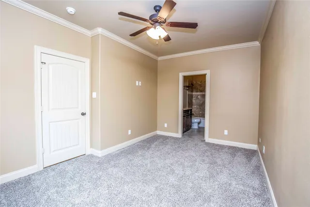 a bathroom with a granite countertop sink a toilet and shower