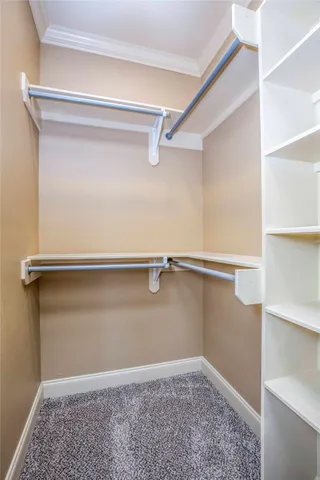 a bedroom with a large bed and a large window