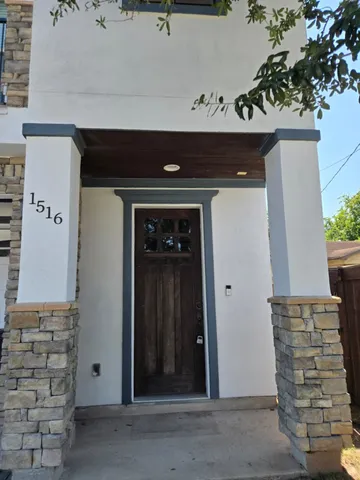 a view of staircase with wooden floor and windows