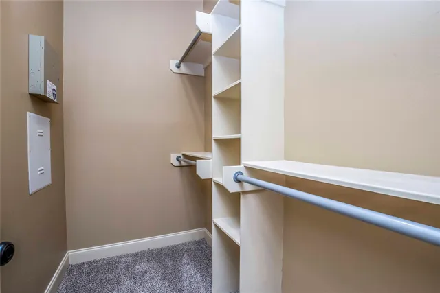 a bathroom with a granite countertop sink a toilet and shower