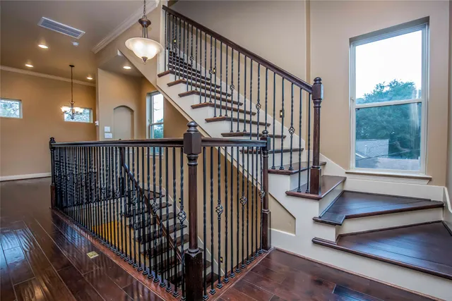 a view of staircase with white walls and windows